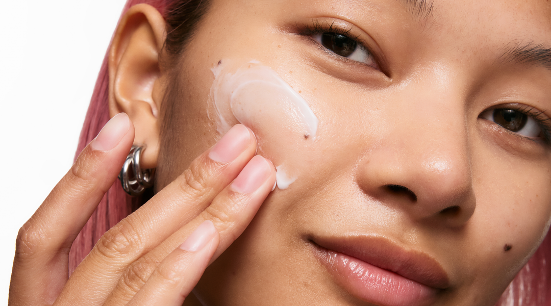 Model applying skincare