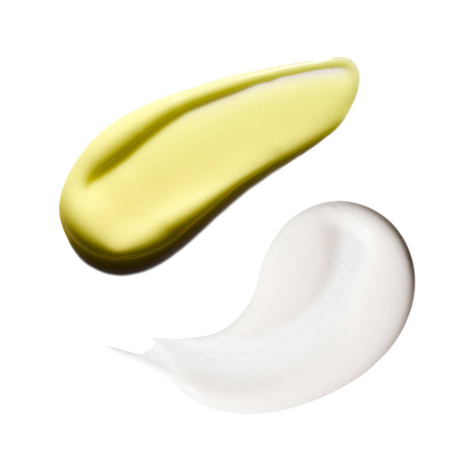 Two swatches of cream, one yellow and one white, on a white background