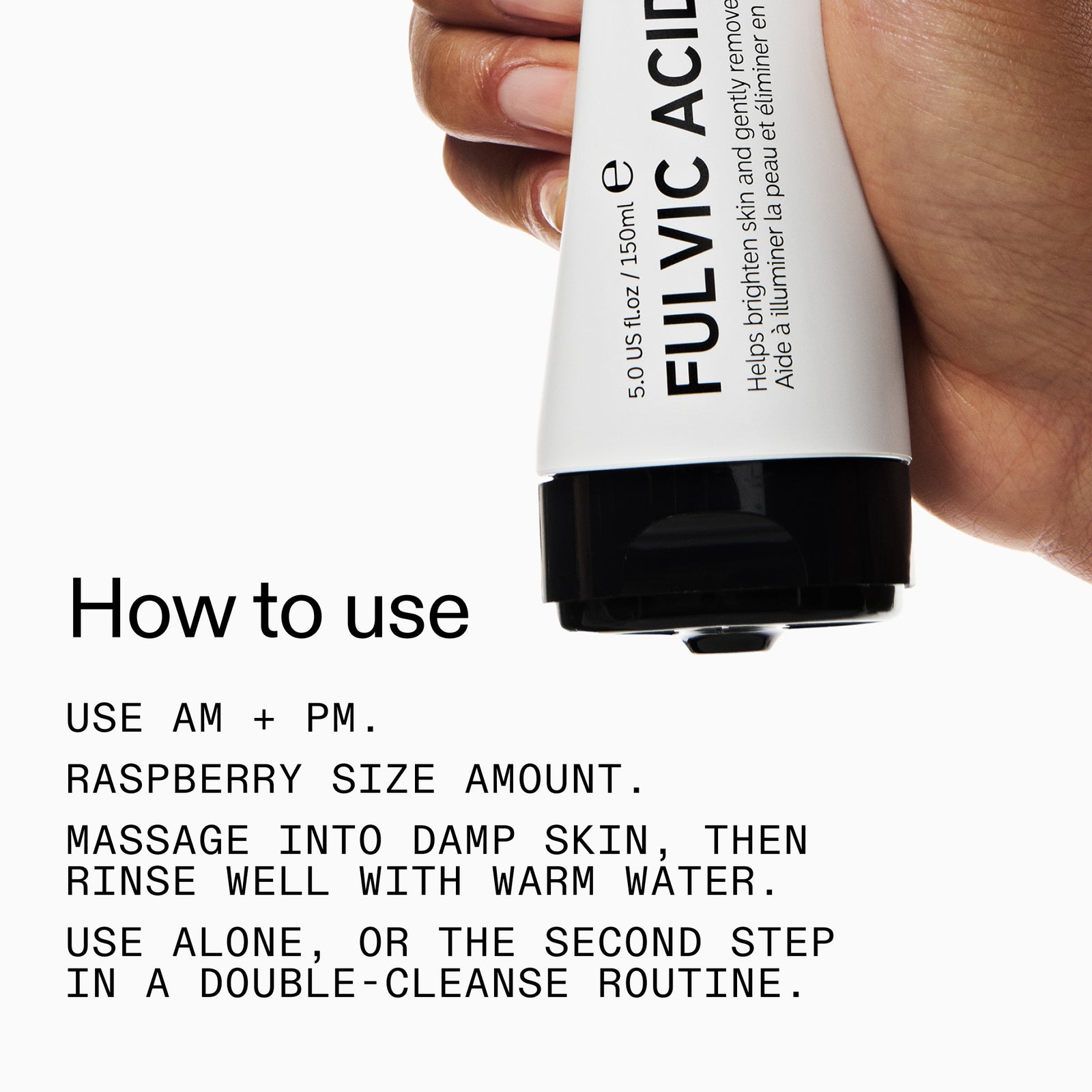 Hand holding a Fulvic Acid skincare product with usage instructions on a white background