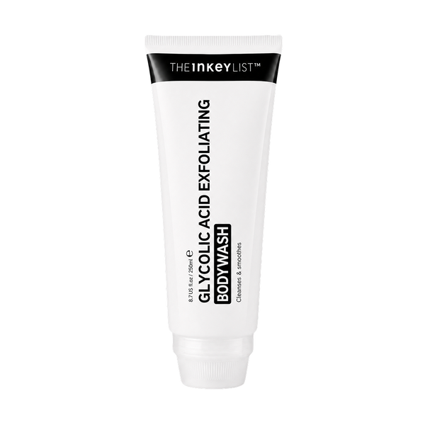 A white squeeze tube of The Inkey List Glycolic Acid Exfoliating Body Wash, featuring black text and a black top band, on a solid white background.
