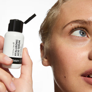 Model holding Hyaluronic Acid Serum