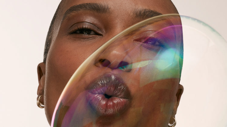 Model blowing a bubble