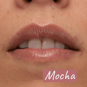 Model wearing the Mocha Tripeptide Lip Balm with annotation 'Mocha'