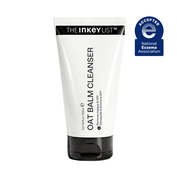 A white squeeze tube of The Inkey List Oat Balm Cleanser with a black cap, shown on a plain white background with a blue National Eczema Association Accepted badge on the top right.