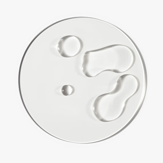 Goop/texture shot of The Hair Growth Booster Bundle against a white background