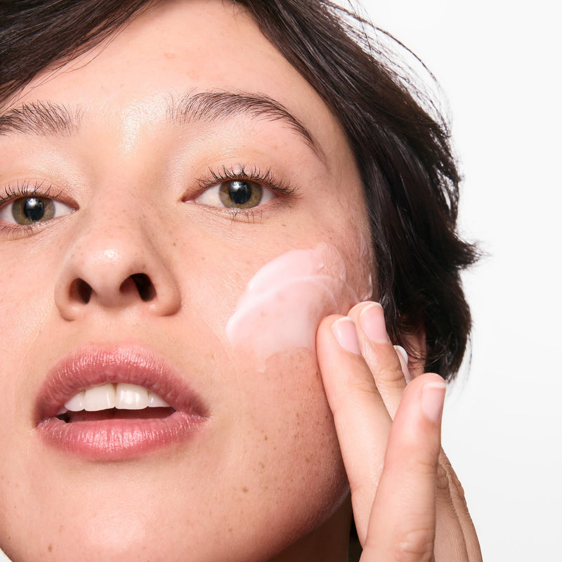 woman with cream on her face
