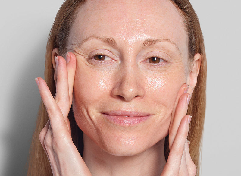 Model applying skincare