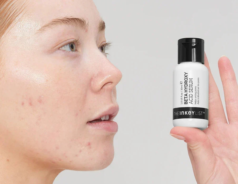woman with BHA bottle