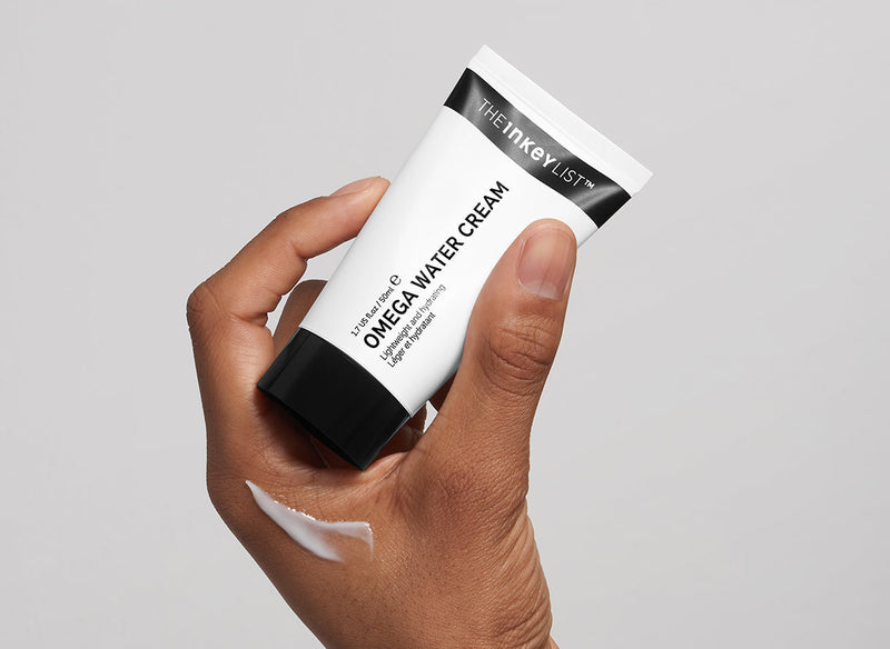 Omega Water Cream in model's hand