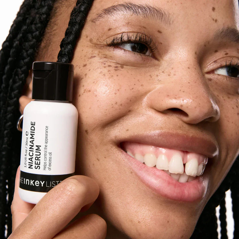 woman holding niacinamide