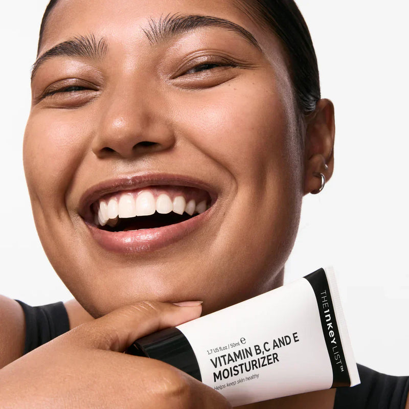Woman holding moisturiser