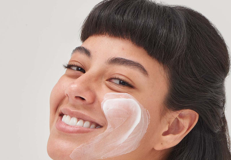 Model with moisturizer on her face