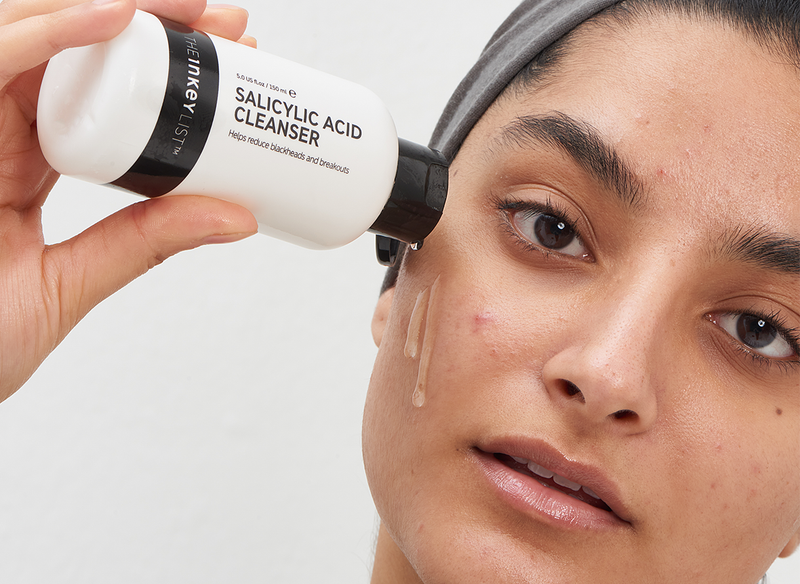Model with Salicylic Acid Cleanser bottle