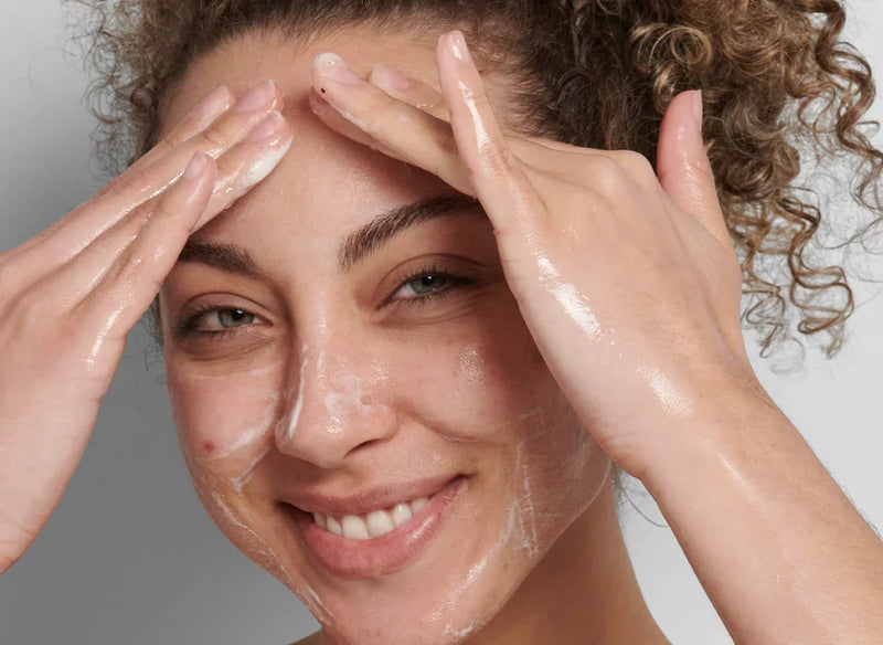woman touching her face