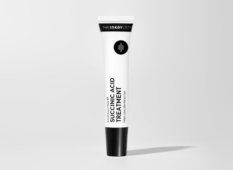 Bottle of Succinic Acid on white background