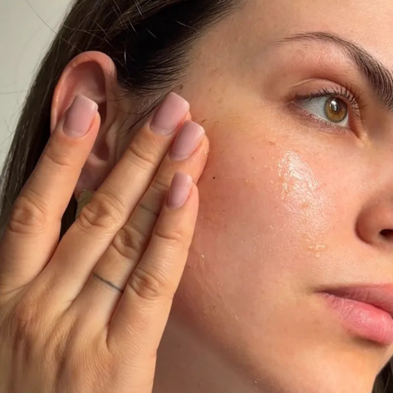 woman touching her face