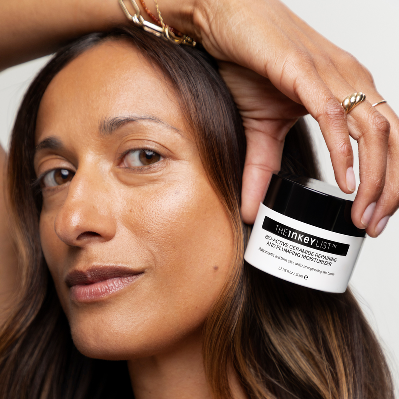 woman holding bio active cream