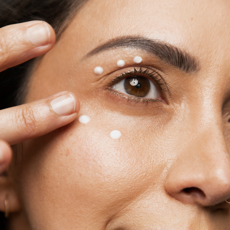 woman applying eye cream