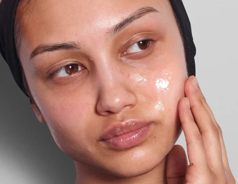 woman touching her face