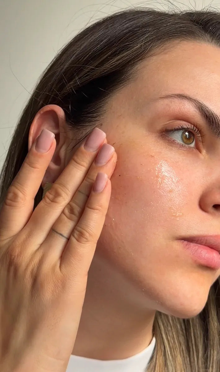 woman touching her face