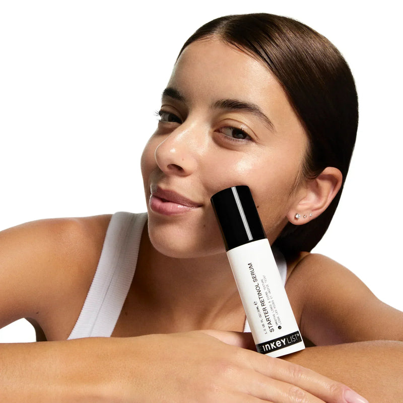 woman posing with retinol serum