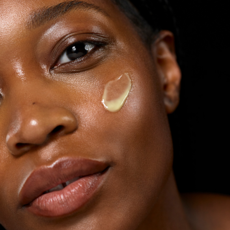 woman with serum on her face