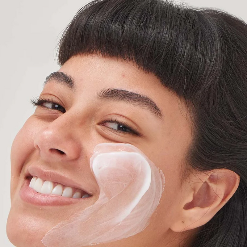 woman with cream on her face