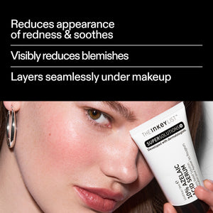 Model applying The INKEY List Azelaic Acid Redness Relief Solution – reduces the appearance of redness and blemishes and layers seamlessly under makeup