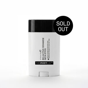 White neck stick with black cap on a white background, featuring 'The Inkey List' branding.