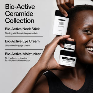 Model holding The INKEY List Bio-Active Ceramide Collection – Neck Stick, Eye Cream and Moisturiser