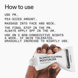 Hand holding a tube of Supersolutions blemish clearing moisturizer with usage instructions.