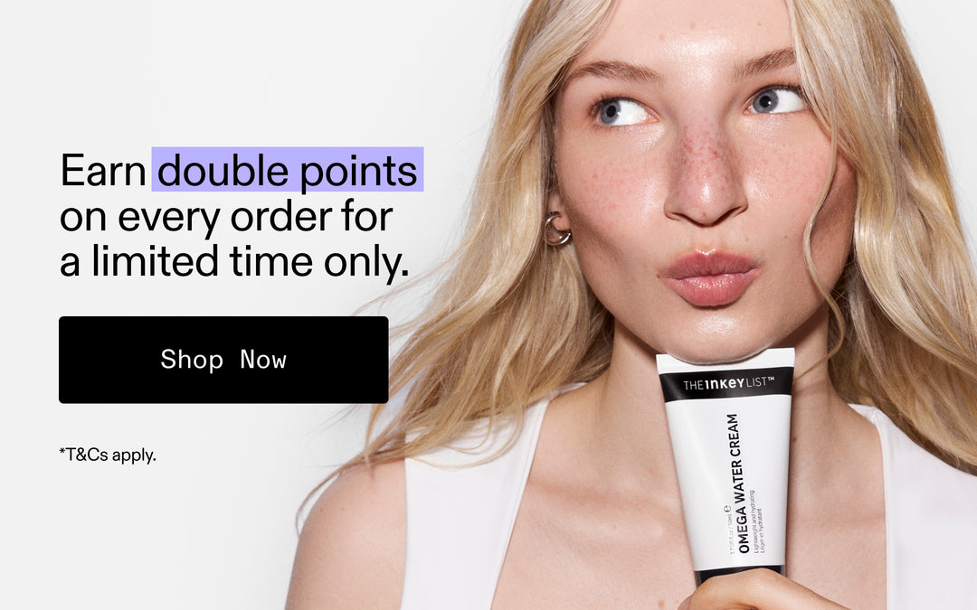 A woman with blonde hair holds a white tube of The Inkey List Omega Water Cream against a light gray background, with promotional text on the left reading 'Earn double points on every order for a limited time only. Shop Now.