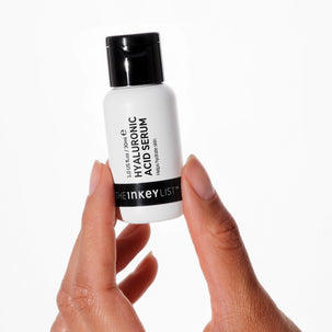 Hand holding Hyaluronic Acid Serum