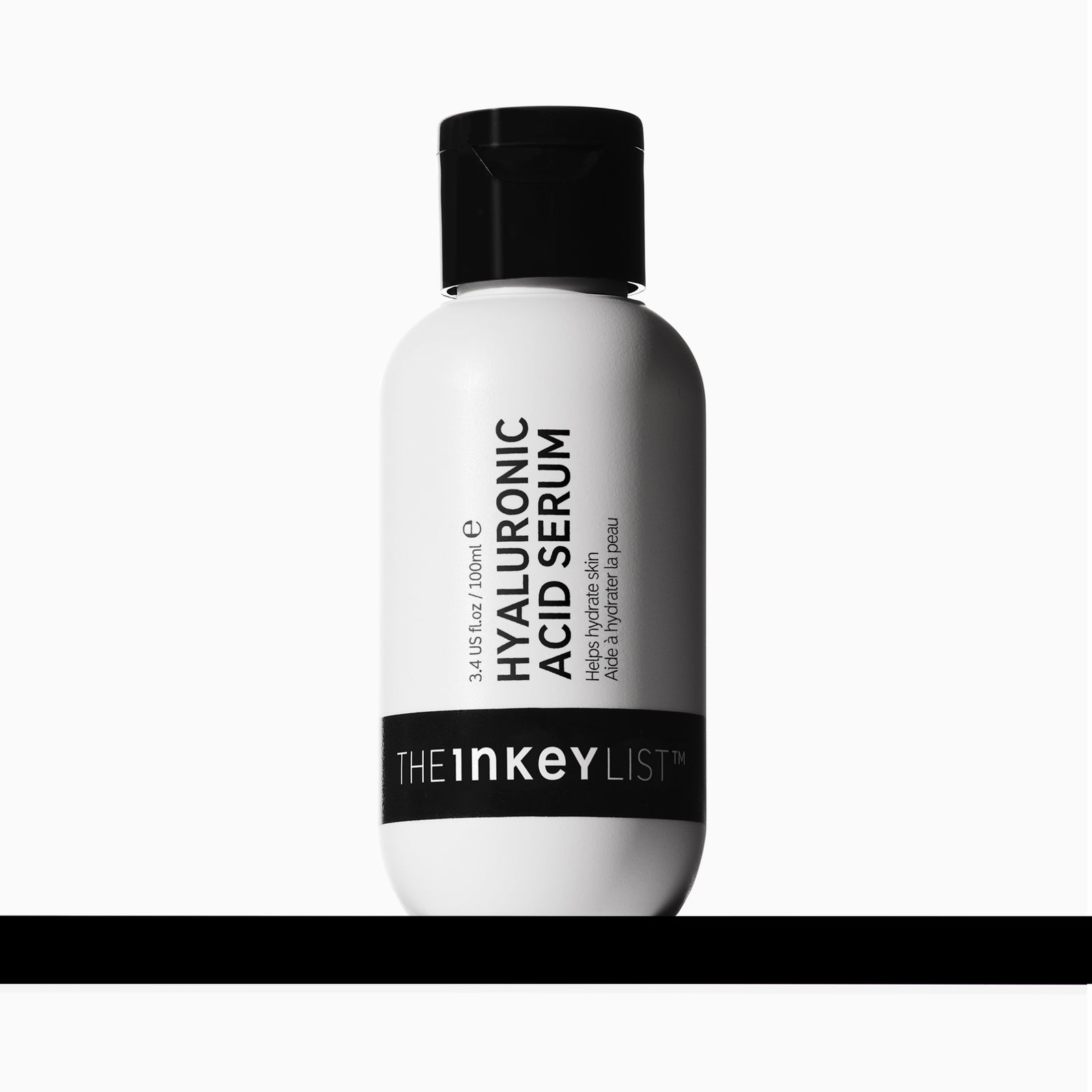 A white bottle of The Inkey List Hyaluronic Acid Serum with a black cap, centered against a light gray background with a black horizontal bar at the bottom.