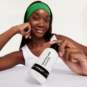 Model with Salicylic Acid Cleanser bottle