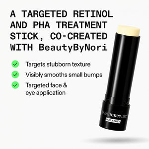 A black cosmetic treatment stick with a pale cream product tip, shown on a light gray background with promotional text. The text reads 'A TARGETED RETINOL AND PHA TREATMENT STICK, CO-CREATED WITH BeautyByNori' and lists three benefits with green checkmarks.