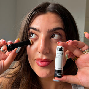 woman posing with Labs Retinol & PHA treatment stick
