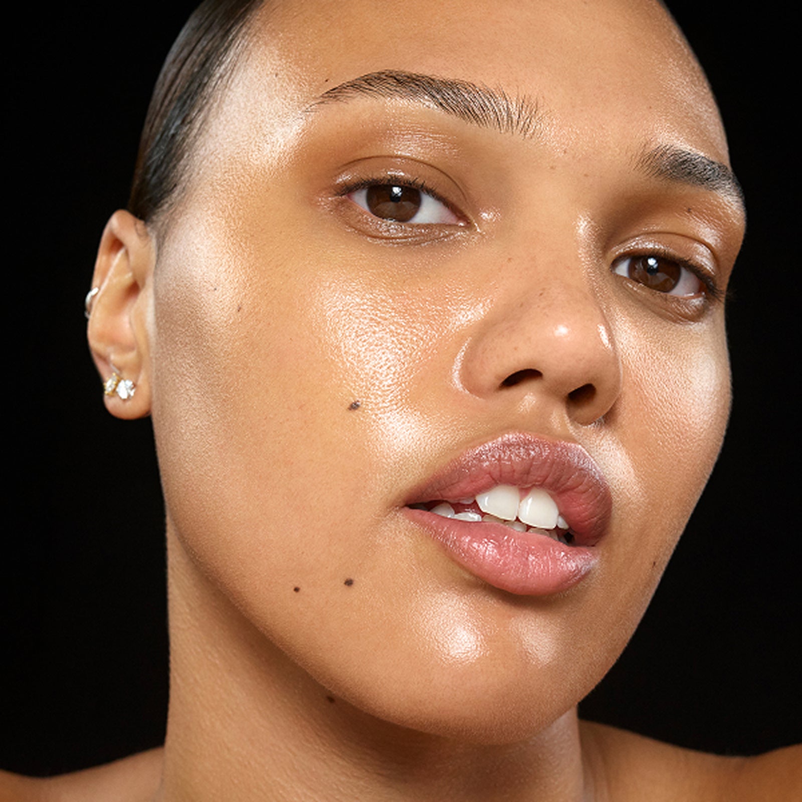 Close-up of a woman's face with a black background