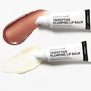 Goop shot of Mocha and Clear Tripeptide Lip Balm with product tube