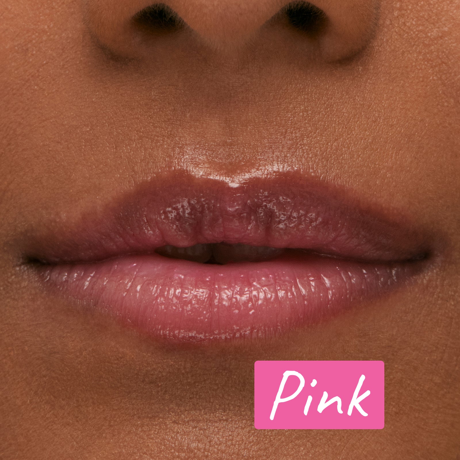 Model wearing the Pink Tripeptide Lip Balm with annotation 'Pink'