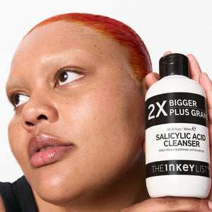 Model holding Salicylic Acid Cleanser