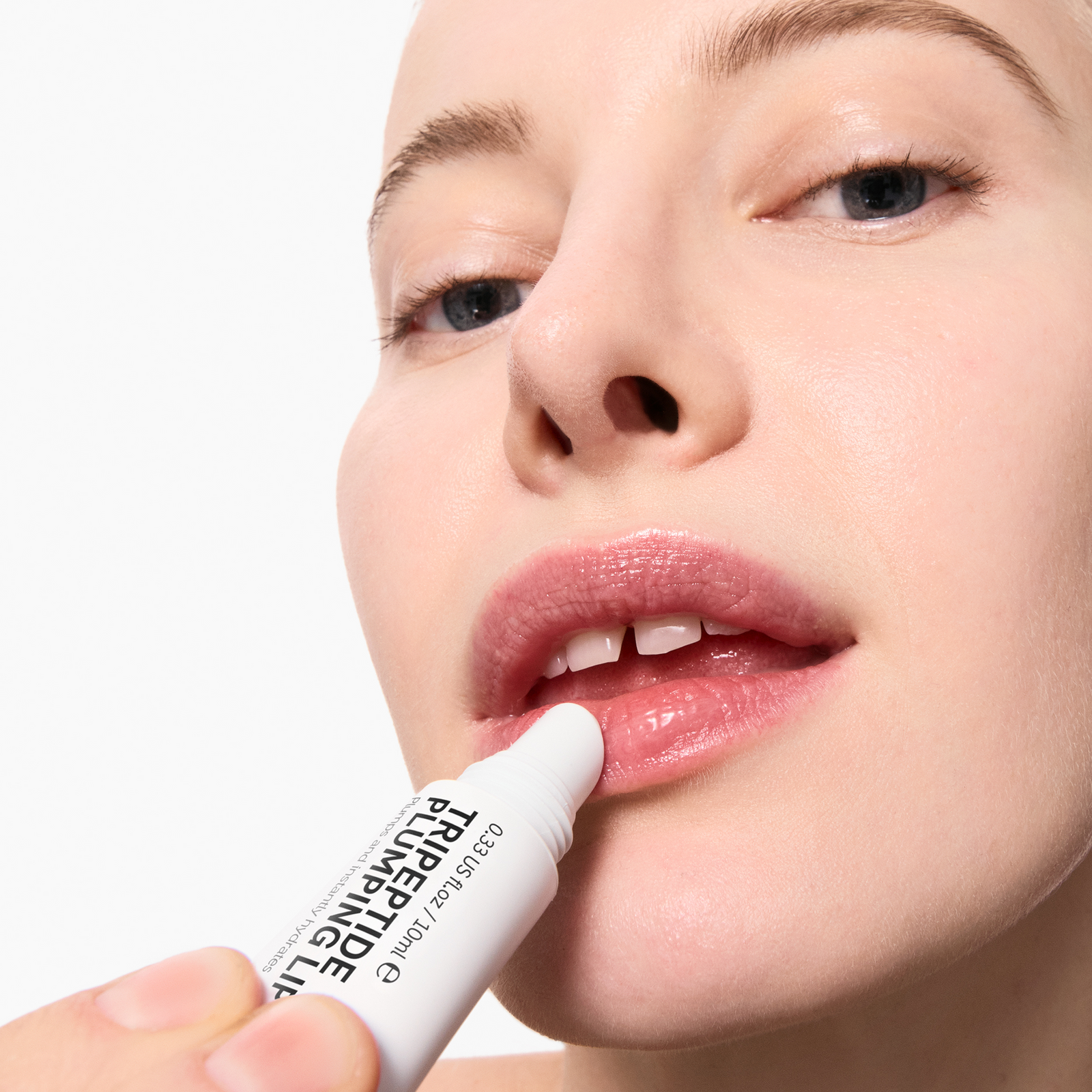 Model applying Tripeptide Lip Balm