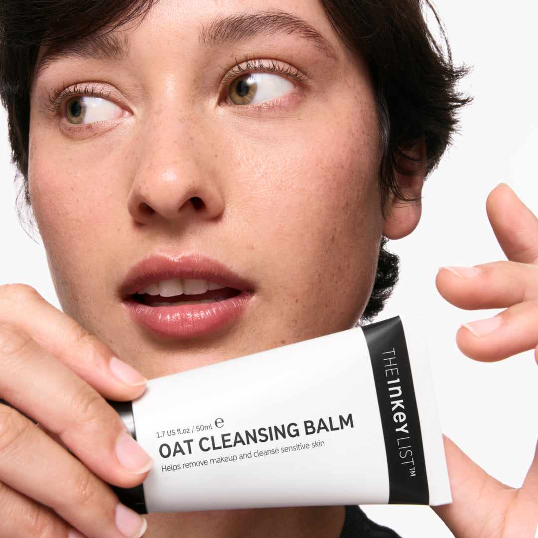 Model holding Oat Cleansing Balm 50ml 