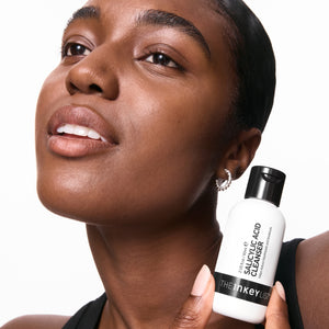 Model with salicylic acid cleanser bottle