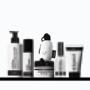 Secret products on a shelf with the free plushie sat on top
