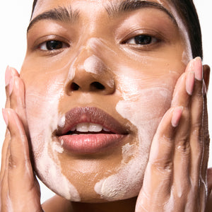 Model with cleanser on skin