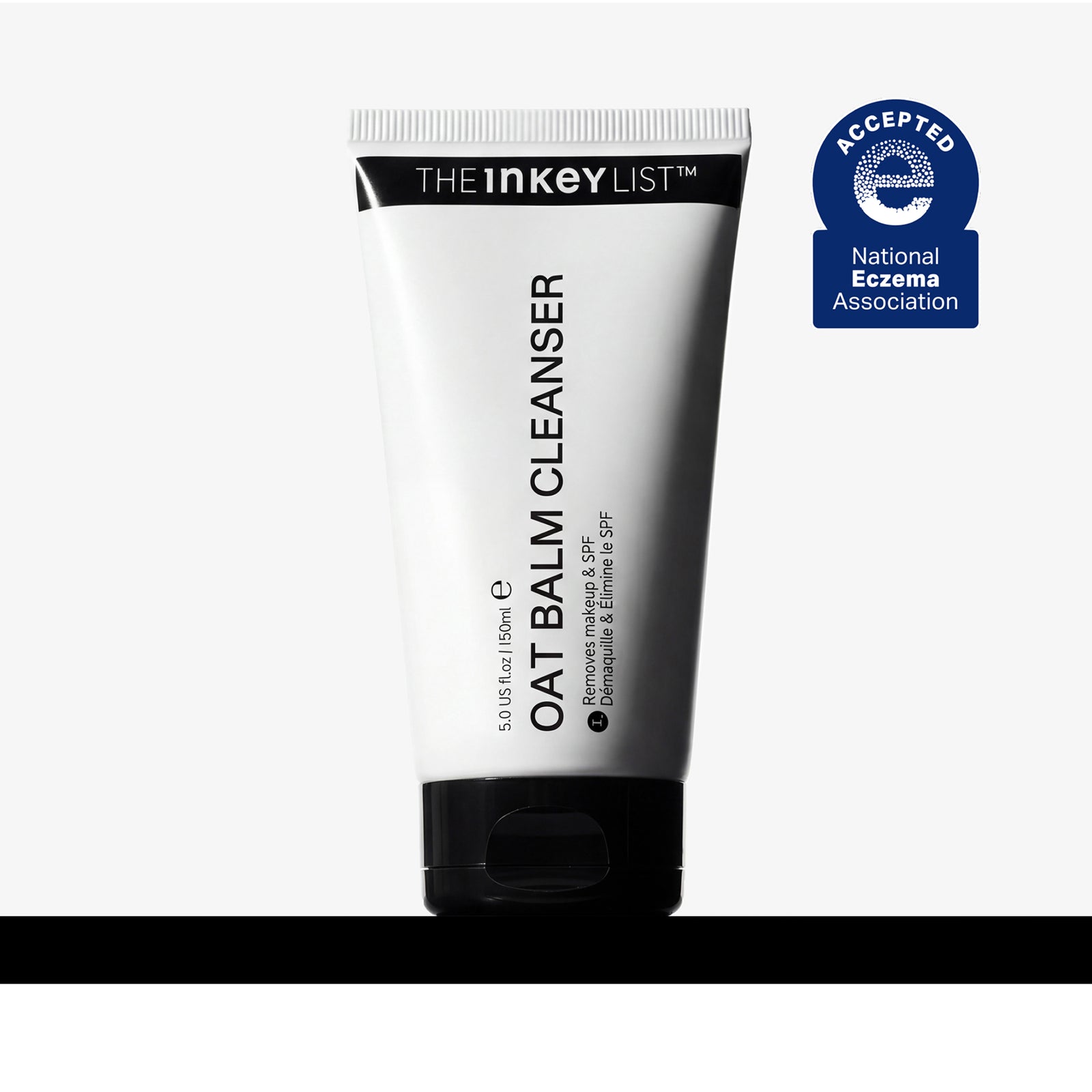 A 150ml squeeze tube of The Inkey List Oat Balm Cleanser, shown on a light gray background with a black horizontal bar at the bottom and a blue National Eczema Association Accepted badge on the top right.