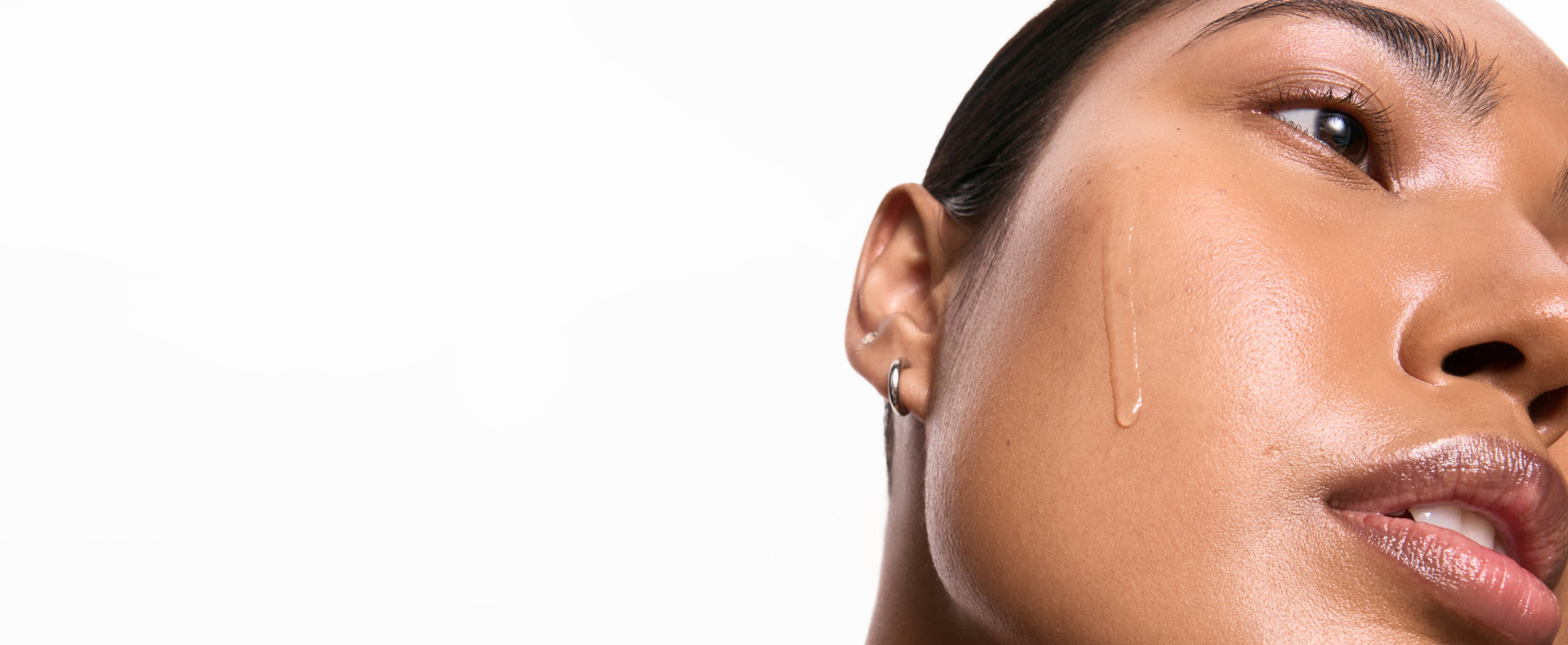Model with serum dripping down face