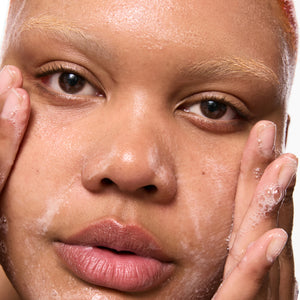 Close-up of a person applying Salicylic Acid Cleanser