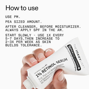 Tube of retinol serum with usage instructions on a white background
